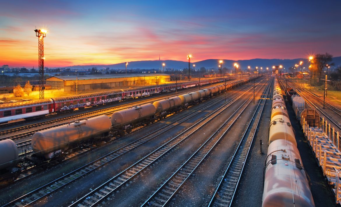 Cargo freigt train railroad station at dusk