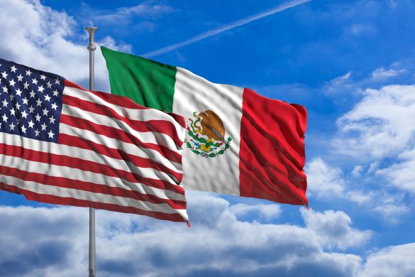 USA and Mexico waving flags on blue sky background . 3d illustration