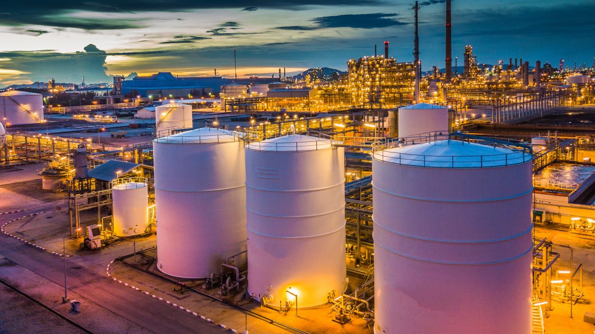 Aerial view oil terminal is industrial facility for storage of oil and petrochemical products ready for transport to further storage facilities.